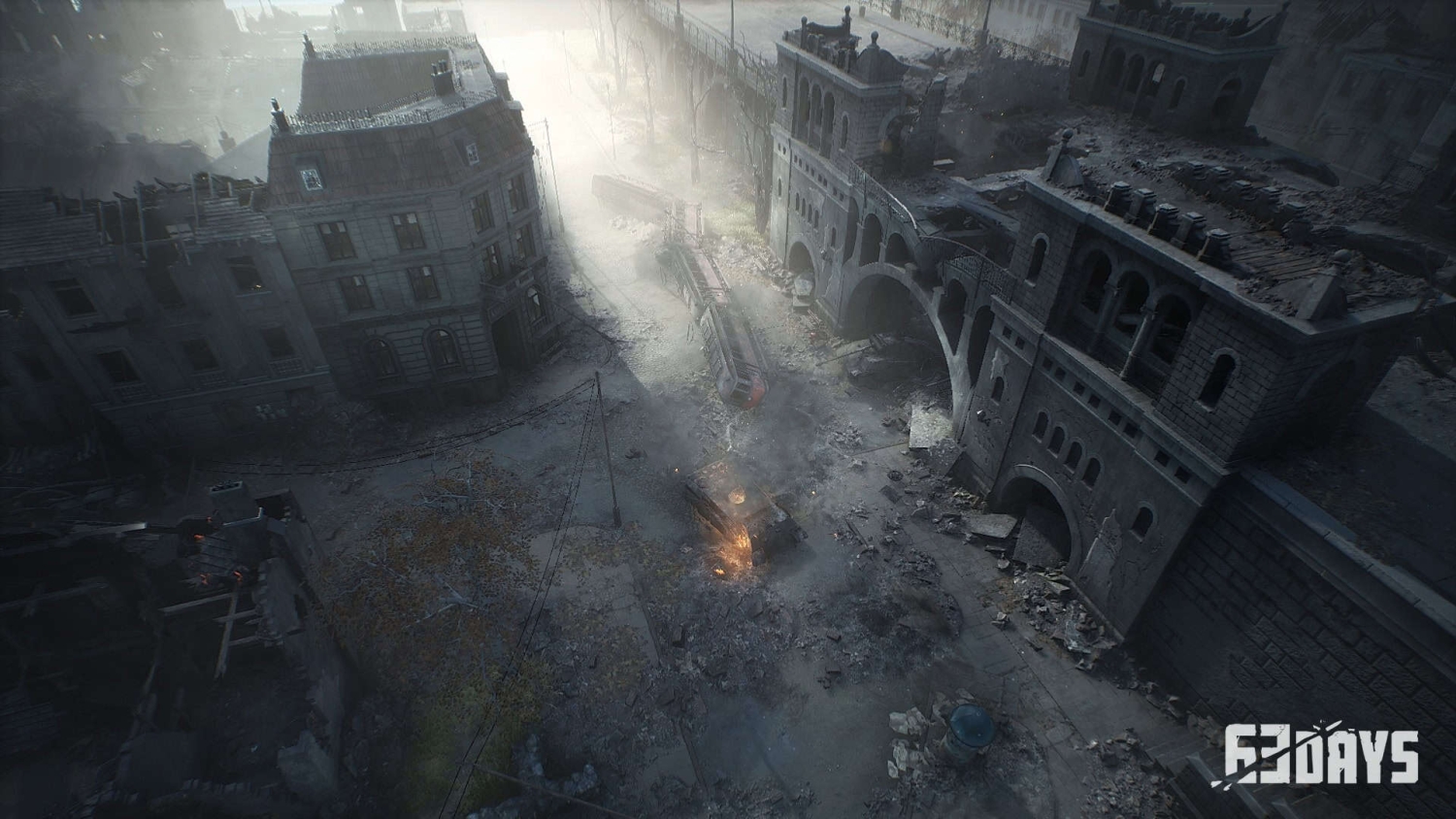 Aerial view of a destroyed urban street with damaged buildings, debris, and burning wreckage