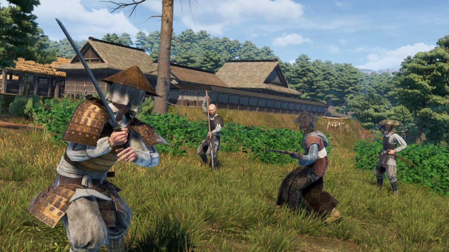 Four samurai warriors in traditional armour performing combat stances in a grassy field near wooden houses