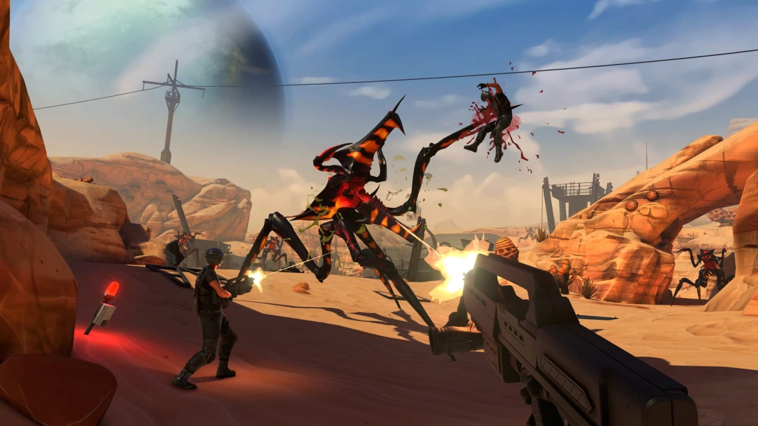 Soldiers armed with guns firing at large insect-like creatures in a desert landscape with rocky formations and a planet visible in the sky
