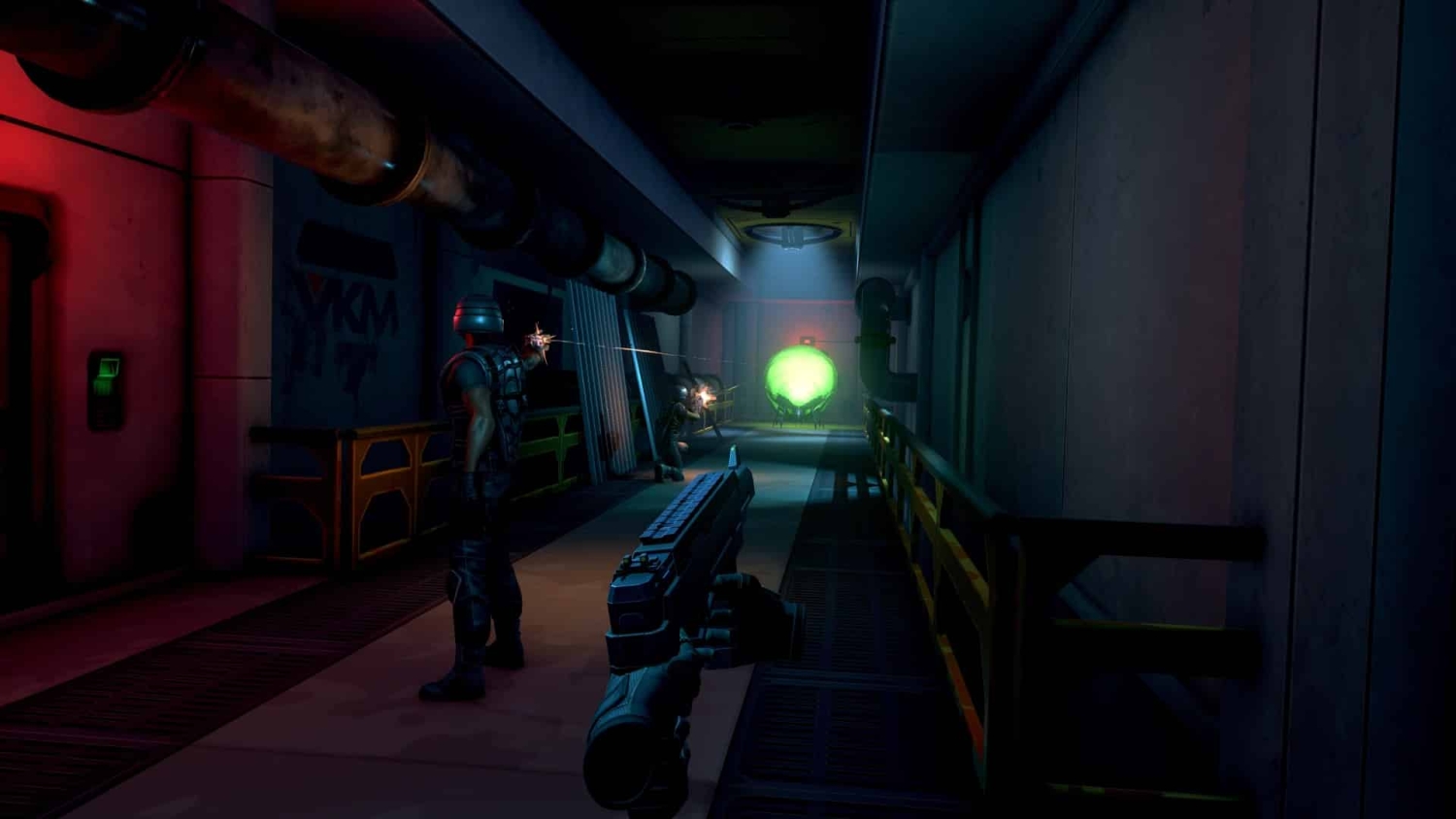 First-person view aiming handgun down a dimly lit industrial corridor with armed enemies and glowing green orb