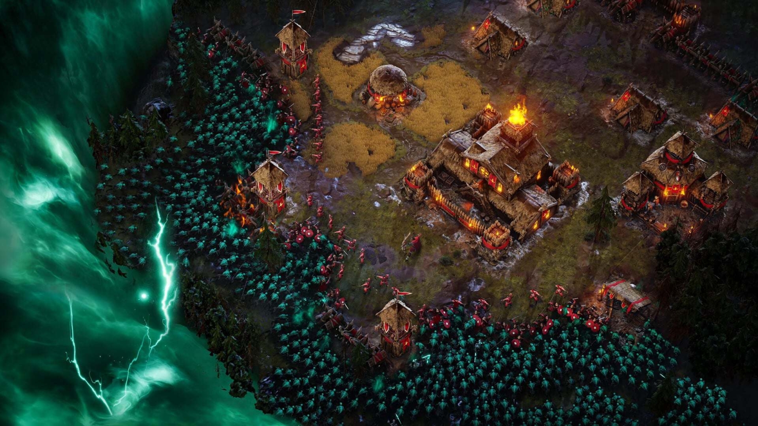 A fortified village with thatched roofs under siege by a vast horde of shadowy figures surrounded by guard towers