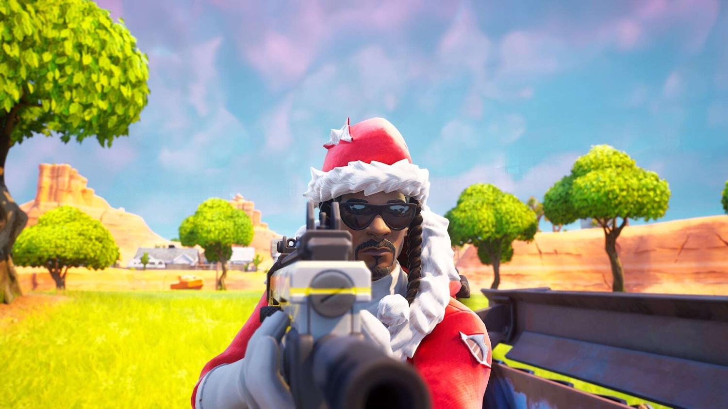 Character wearing a Santa hat and sunglasses aiming a gun in a bright colourful outdoor game environment