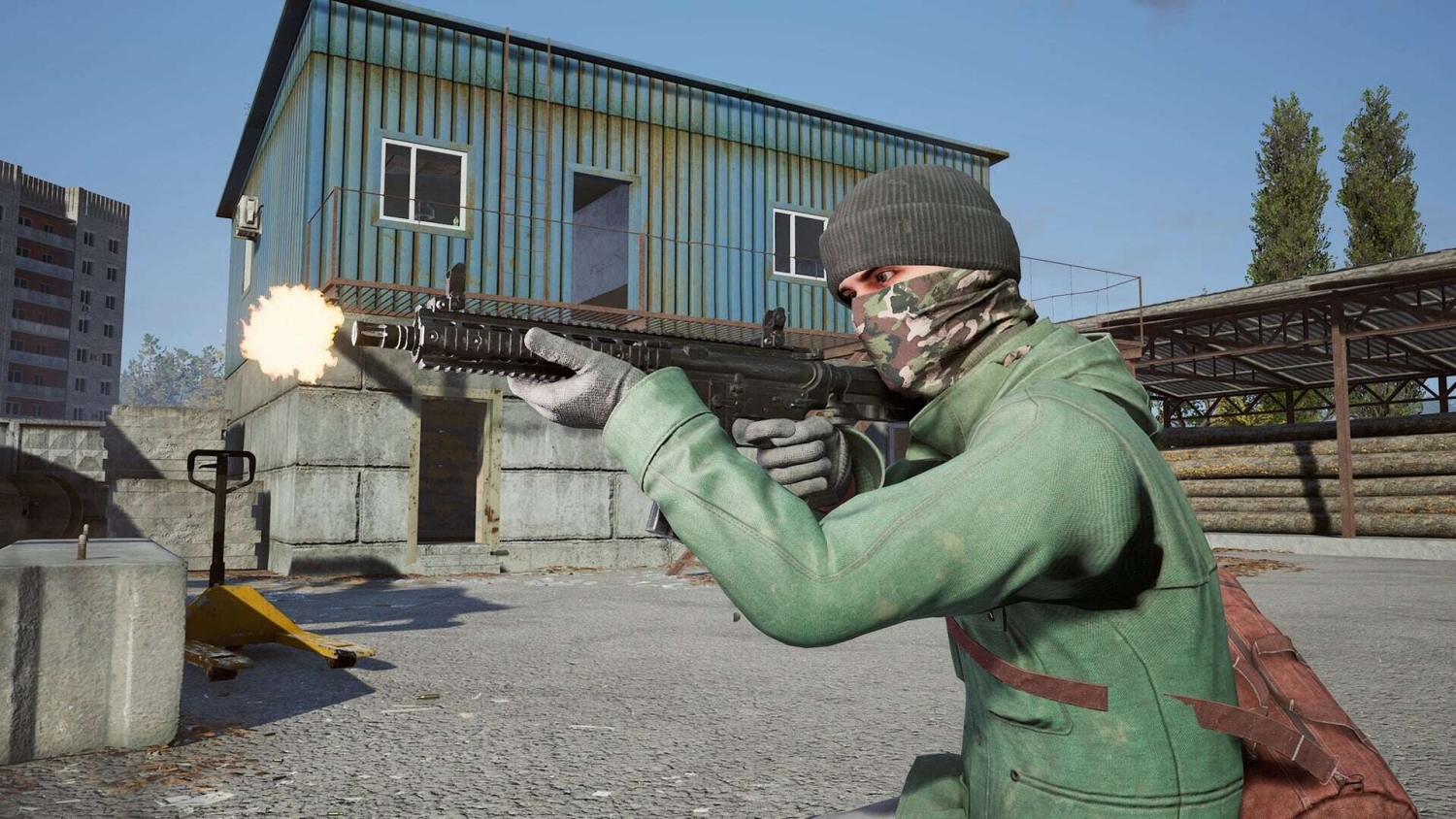 Person in green jacket and camo scarf firing rifle in an industrial urban setting during daylight