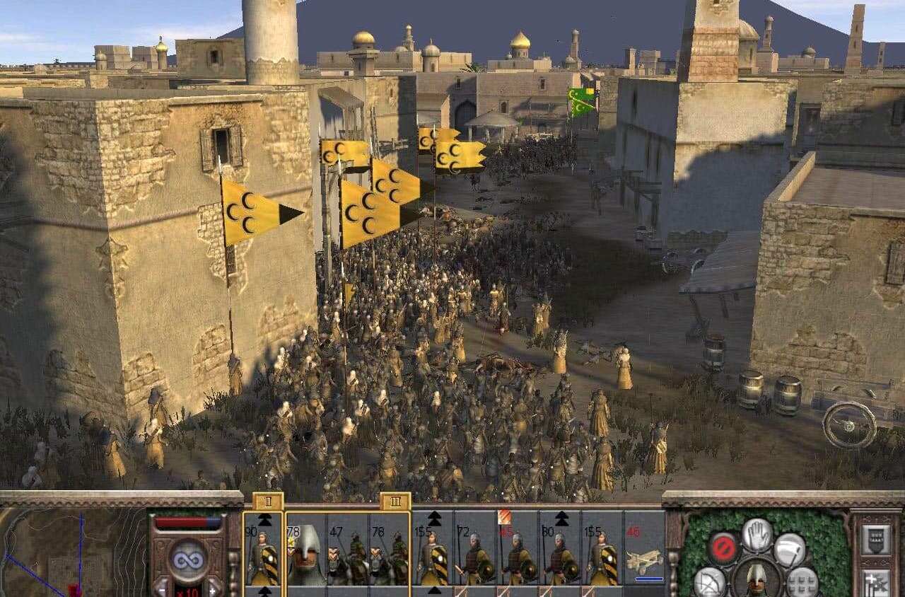 Large medieval army with yellow crescent moon flags advancing through narrow stone street