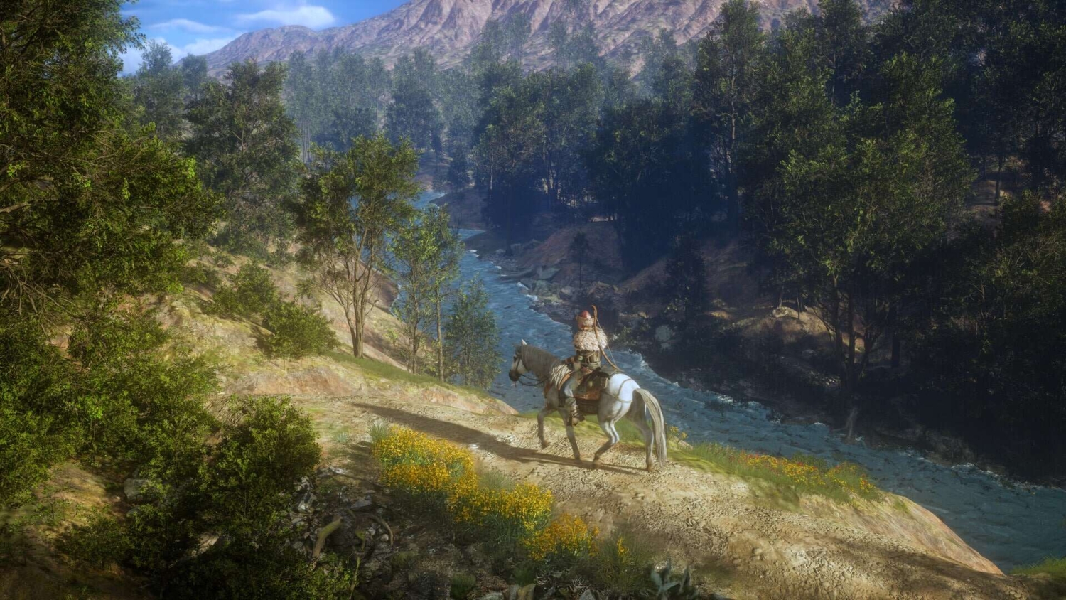 Armoured rider on a white horse overlooking a flowing river surrounded by dense forest and mountainous terrain
