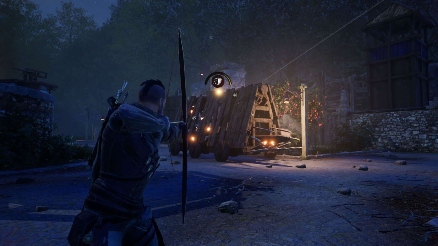 Archer firing an arrow at a wooden siege weapon in a forested village at night
