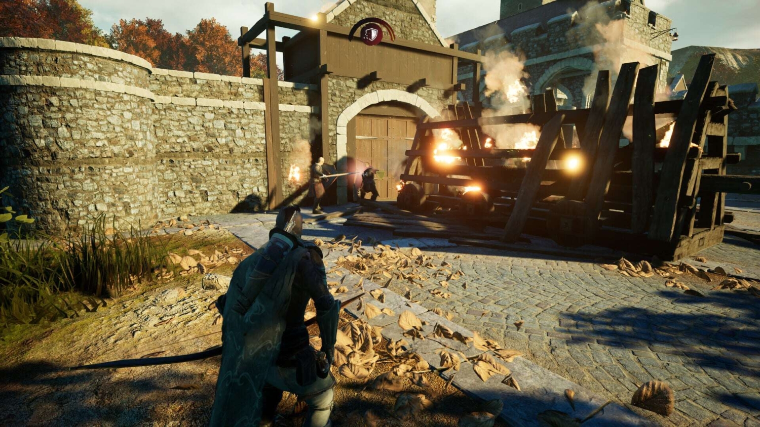 Character aims a crossbow at enemies near a burning wooden barricade in a stone courtyard with autumn foliage