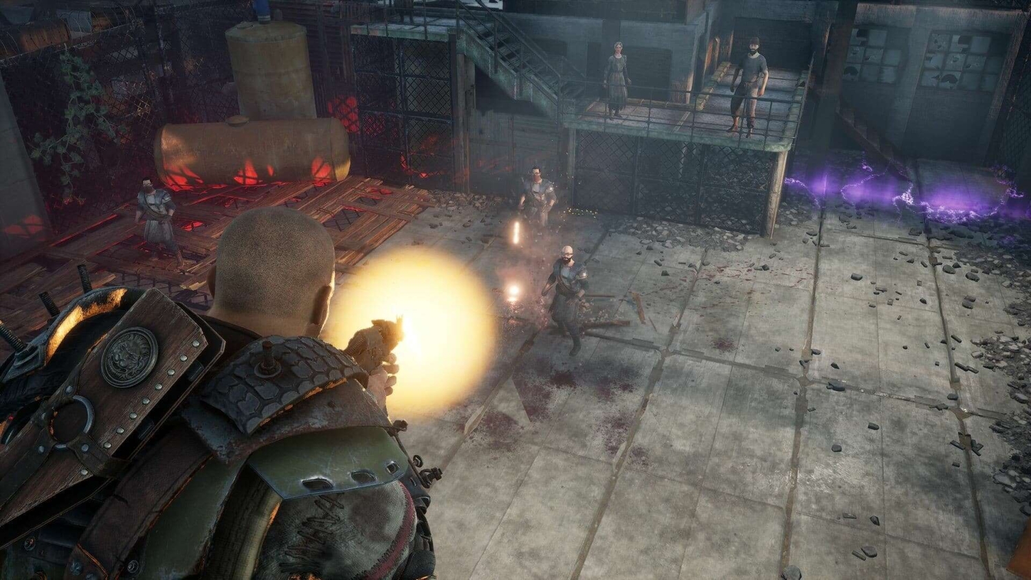 Armoured character firing a handgun at three approaching enemies in a dilapidated industrial area with concrete floors and metal fencing