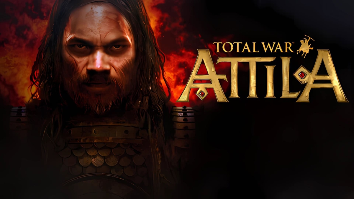 Close-up of a bearded warrior with long hair and armour in front of flames beside Total War Attila logo