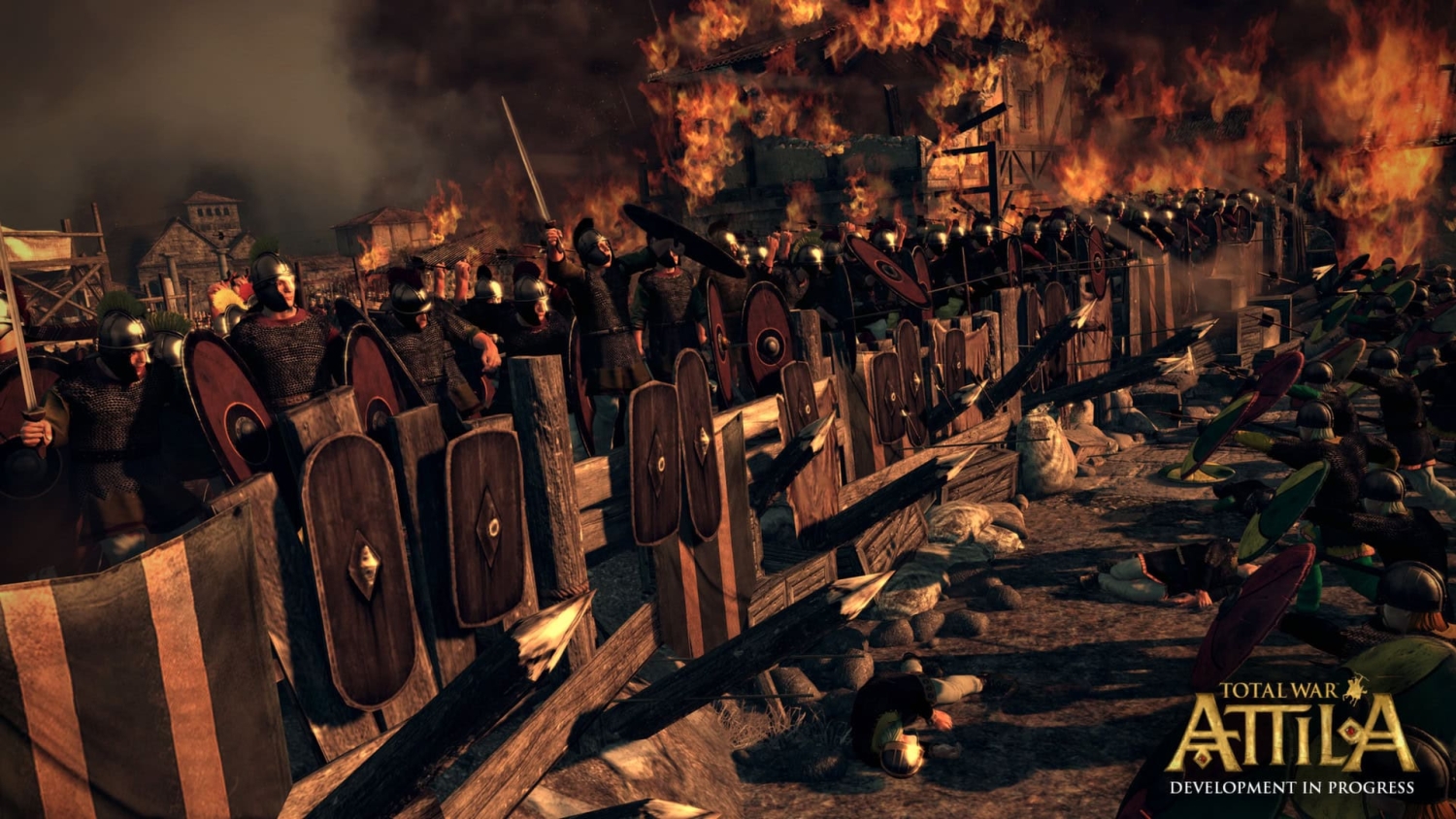 Roman soldiers with shields form a defensive line behind wooden barricades in front of a burning fort in battle