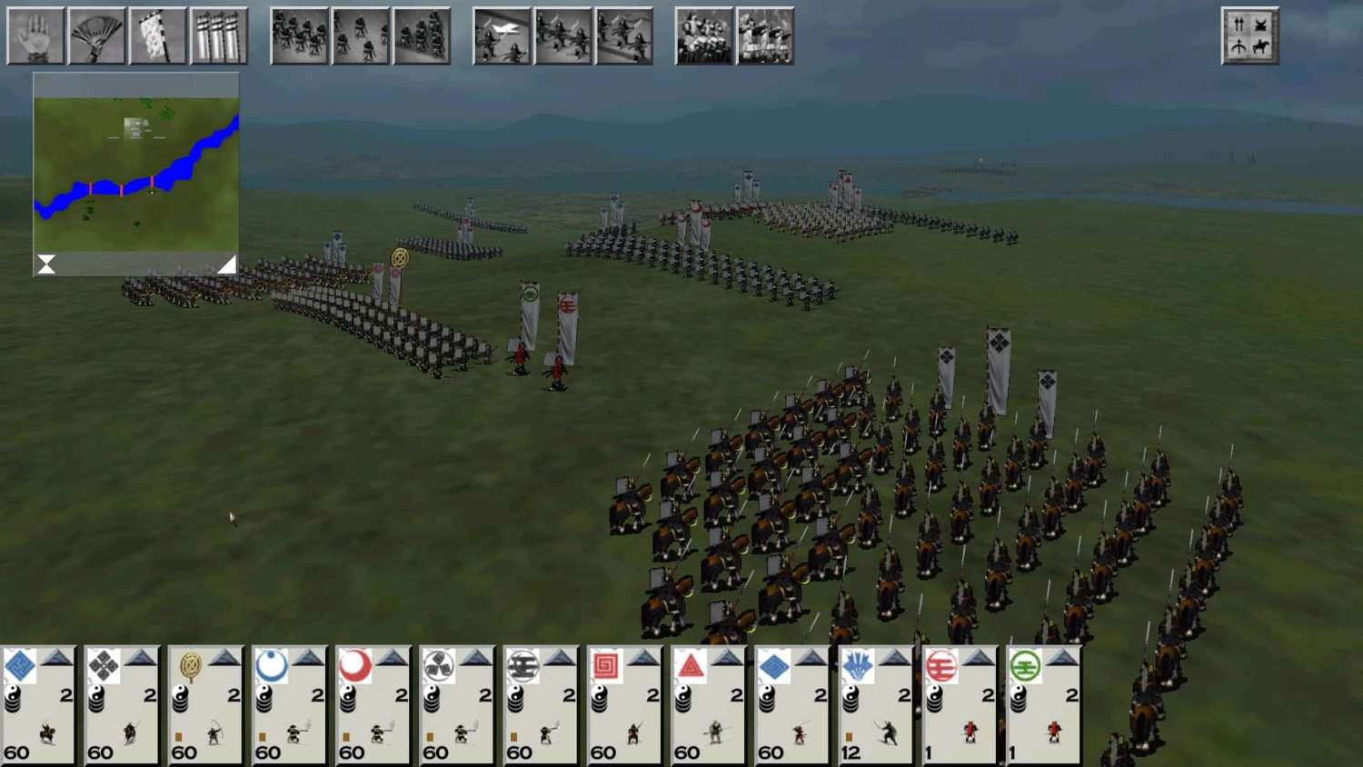 Overhead view of organised infantry and cavalry units arranged in battle formation on a grassy plain