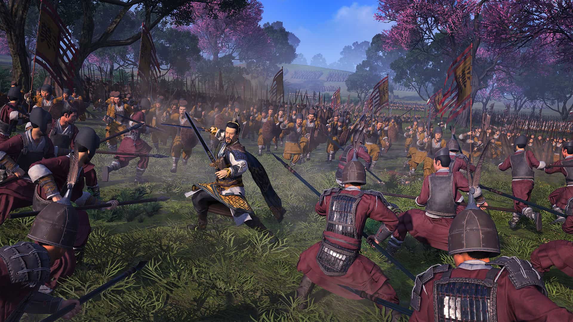 Armoured soldiers in historical Asian attire engaging in close combat on a grassy battlefield