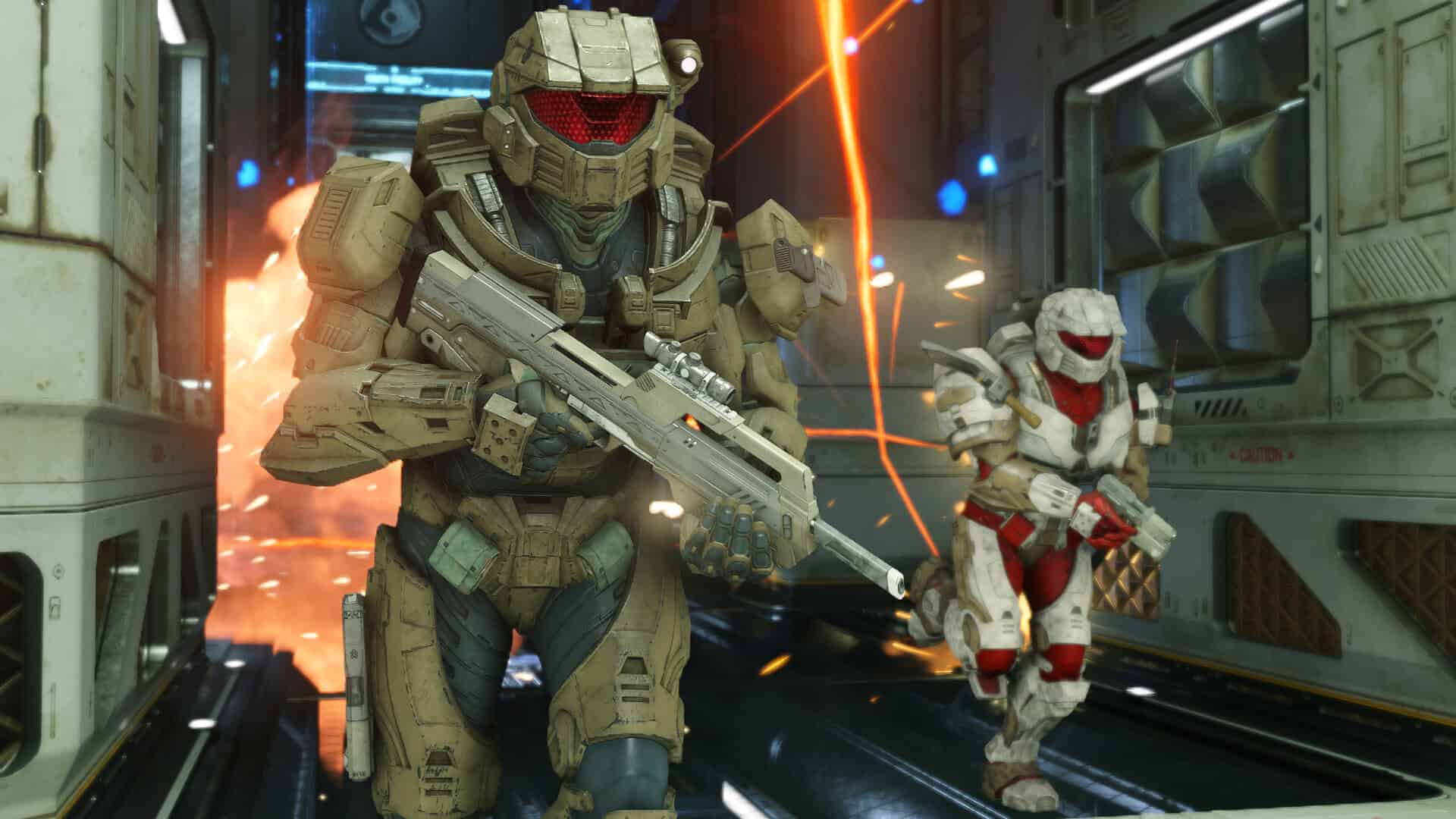 Two futuristic soldiers in armour wielding rifles run through a corridor amid sparks and fire