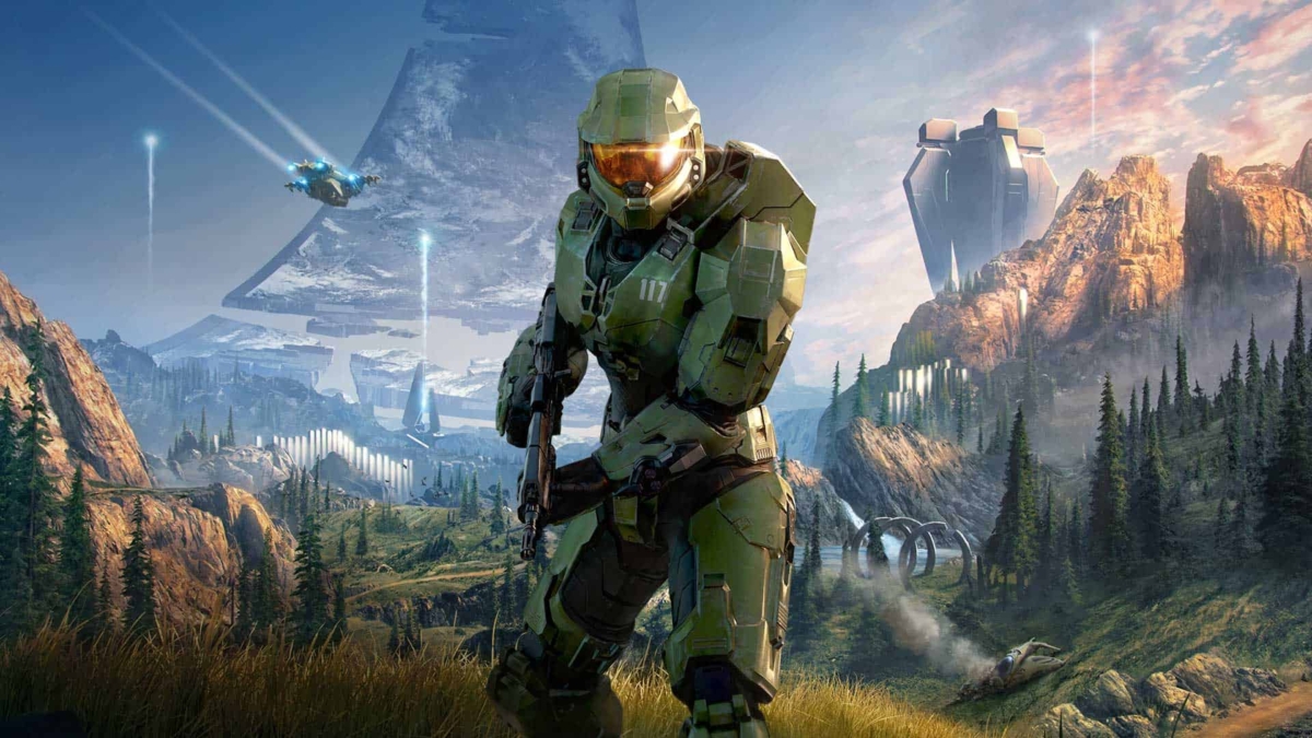 Armoured Spartan soldier in green suit aiming rifle on a grassy plain with mountainous alien background and futuristic spacecraft